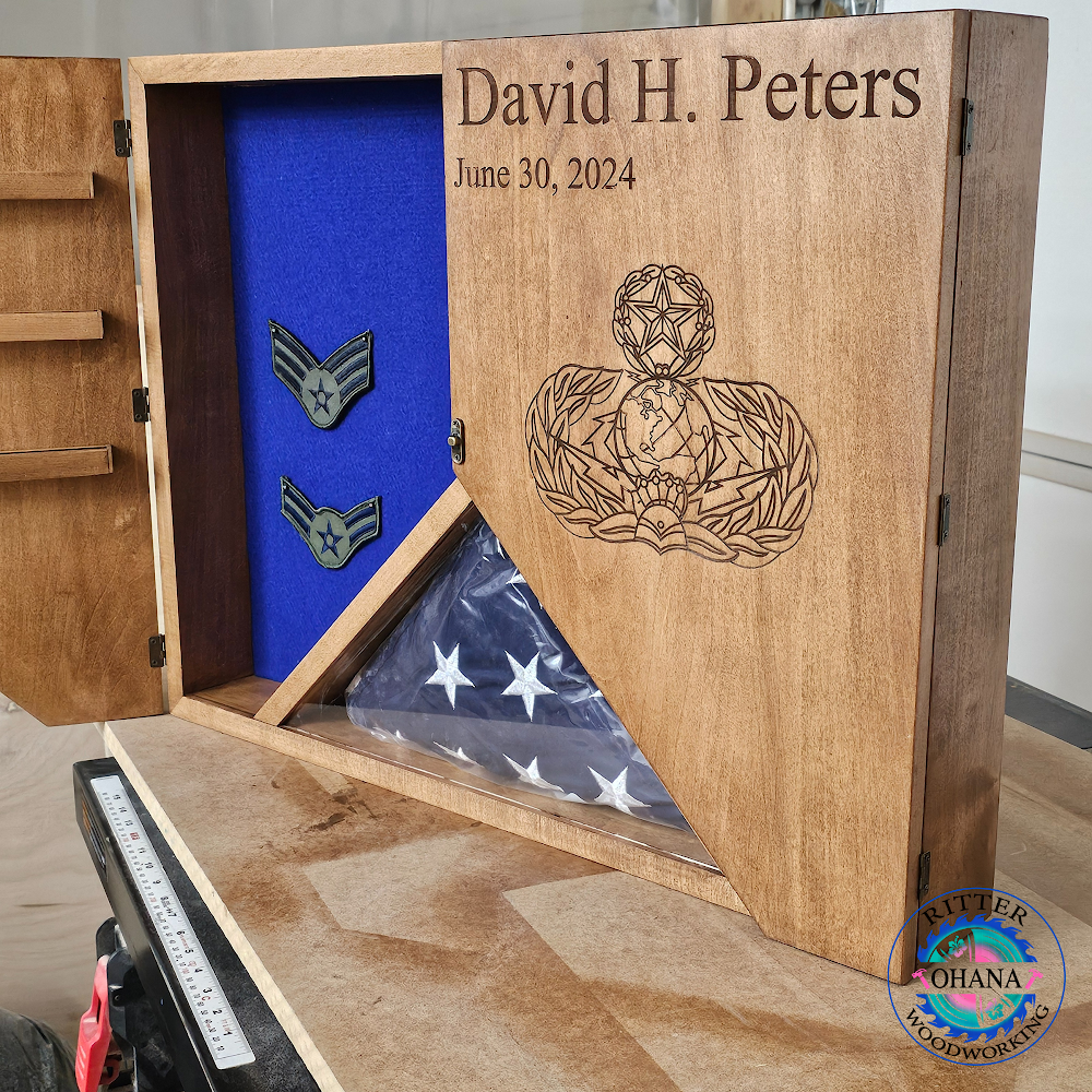 shadow box with flag display on bottom, doors open to show inside with blue background for display items