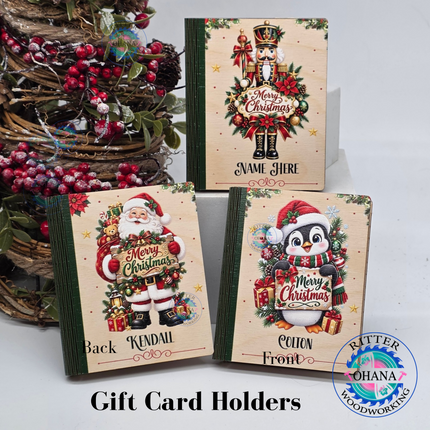 Personalized wooden Christmas gift card holders featuring Santa Claus, nutcracker and penguin designs with custom names and festive holiday artwork.