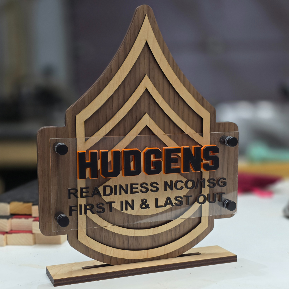 Wooden plaque of military rank, engraved text and name over lay of rank with stand for shelf