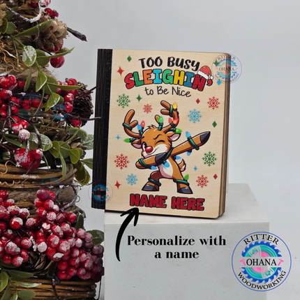 Personalized wooden Christmas gift card holder for kids featuring a colorful dabbing reindeer, Too Busy Sleighin' to Be Nice saying, custom name, 
