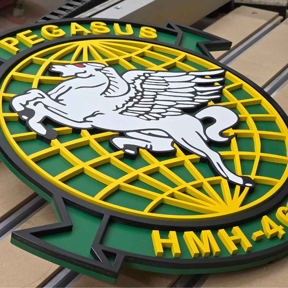 Decorative emblem with Pegasus logo and 'PEGASUS HMH-4' text on a green and yellow background.