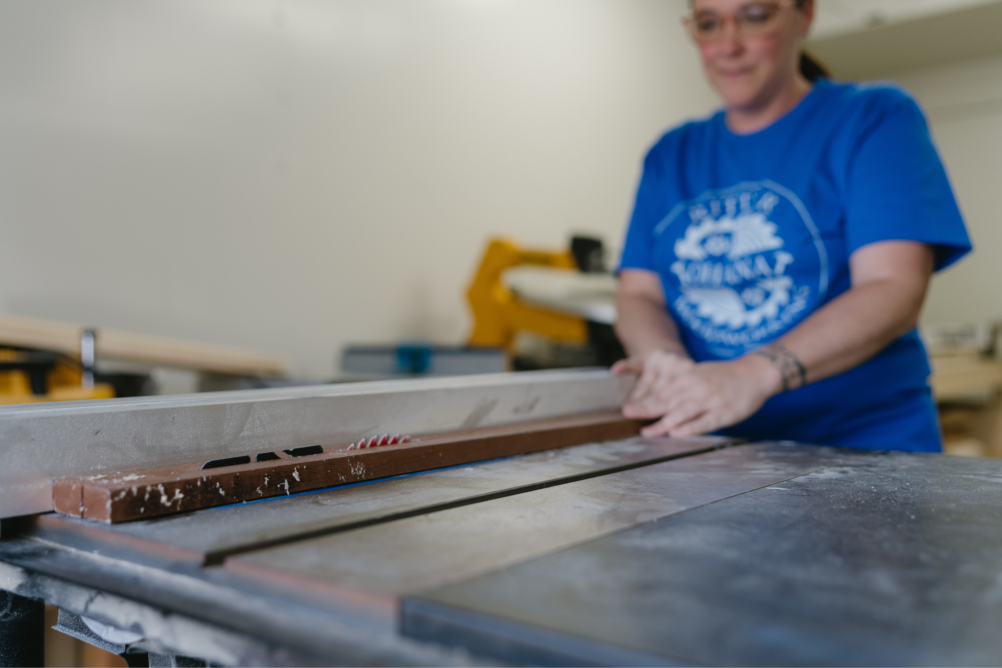 cover photo of maker cutting wood on a table saw